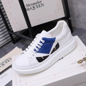 Pair of White Alexander McQueen-style oversized sneakers with Cobalt Blue crocodile-embossed panels, black inserts, and gold accents, shown on a white background.