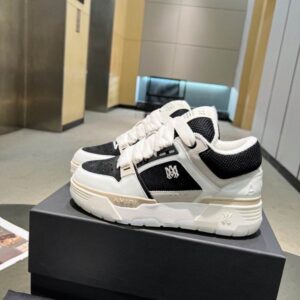 Side profile of Amiri Court Low Sneaker "Midnight Panda" in black and white leather with embroidered logo.