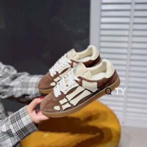 Top and side views of the Amiri Skayside Brown White Sneaker showing the rich brown leather panels, white star-perforated toe, and chunky white midsole.