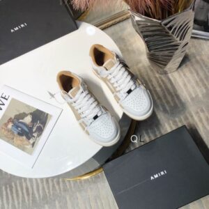 The AMIRI Skel Top Low White Tan Sneakers