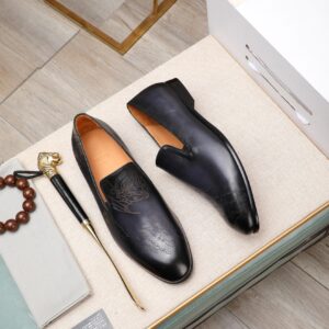 Men's Berluti Burgundy Scritto Venezia Loafers with hand-dyed patina and calligraphy engraving.