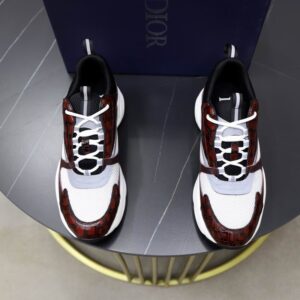 A pair of Dior B22 Burgundy Crocodile Embossed Leather and White Mesh Sneakers, featuring burgundy croc-embossed calfskin, white mesh, and a chunky white midsole.