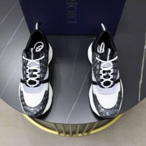 A top-down view of the Dior B22 Grey Mock-Croc and White Mesh Sneakers, featuring grey mock-crocodile embossed leather, white mesh, and white laces.