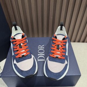 Top view of Dior Blue and Cream B25 Runner Sneaker with orange laces and technical mesh.