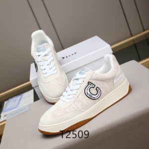 Side view of Dior White and Beige Oblique Canvas B27 Low-Top Sneakers featuring a circular logo patch and gum sole.