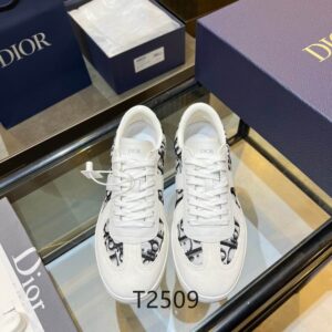 Top-down view of Dior White and Grey Oblique Canvas B27 Low-Top Sneakers with white laces on a glass table.