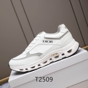 Side view of white DIOR B30 sneakers featuring grey accents and a chunky white midsole, resting on a white branded shoe box.