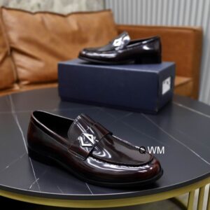 A top-down view of DIOR Stellar Galaxy Patina Leather Loafers in deep burgundy, featuring a glossy gradient finish and silver diamond hardware on a grey table.