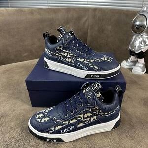 Side view of Dior Deep Navy and Beige Oblique B27 Low-Top Sneaker with navy leather and Oblique canvas panels.