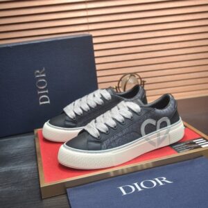 Side profile of Dior Grey and Black Wool Suede B27 Low-Top Sneakers with white embroidery and white laces.
