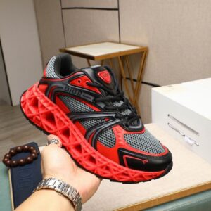 side-profile view of the red Dior B33 sneaker featuring a vibrant red lattice cage over grey mesh and a chunky, sculptural red rubber midsole.