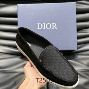 Overhead view of DIOR Granville Loafers in black suede with black Oblique jacquard inserts next to a blue DIOR branded box.