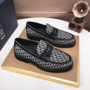 Dior Oblique Black and White Monogram Loafer featuring a thick black lugged sole and leather penny strap detail.