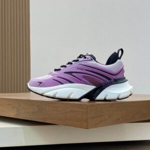 A side-profile view of the purple and white Dior Vibe low-top sneaker featuring a gradient technical upper, black accents, and a chunky white rubber sole.