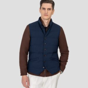 A luxurious quilted down vest in a wool-silk blend featuring a stand collar, button closure, and adjustable tabs at the waist for a tailored fit.