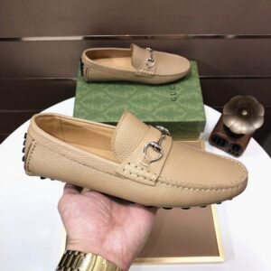 chocolate brown patent leather Gucci-inspired loafers with silver hardware, shown alongside a signature burgundy box.