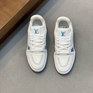 Frontal view of a pair of white LV Trainer inspired sneakers with bright blue logos and blue accents on the sole