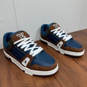 LV Trainer Style Low Sneaker Cobalt Blue and Monogram Brown on wood floor.