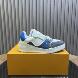 Pair of White, Grey, and Electric Blue Court Trainer Sneakers on a wooden table with a white sole and thick white laces.