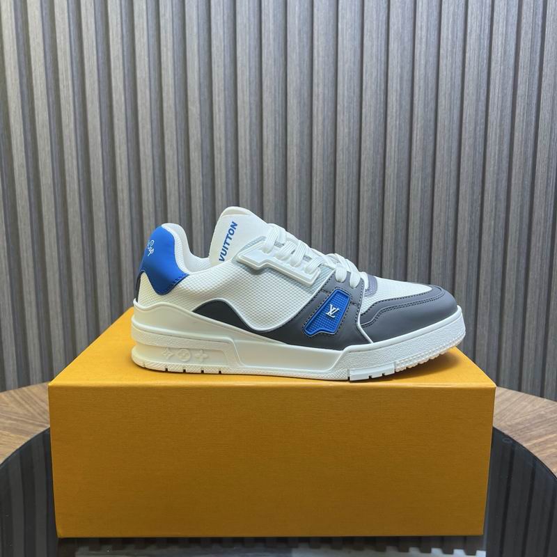 Pair of White, Grey, and Electric Blue Court Trainer Sneakers on a wooden table with a white sole and thick white laces.