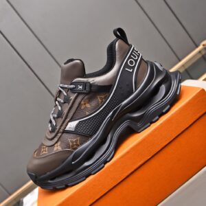 Side profile showing the oversized black sculpted sole and white piping of the Taupe Monogram sneaker.