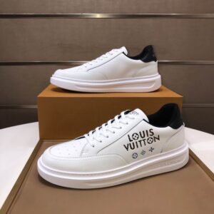 A pair of black and white Louis Vuitton Contrast Low-Top Trainer Sneakers, showing the two-tone leather upper, white sole, and black Louis Vuitton logo on the side panel.