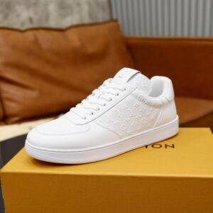 All-White Louis Vuitton Low Top Leather Trainers with a debossed monogram texture and tonal laces, displayed.