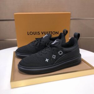 A pair of all-black Louis Vuitton Knit Sock Runner Trainer Sneakers, showing the knit texture, white Monogram symbols on the side and tongue, and the black rubber sole.