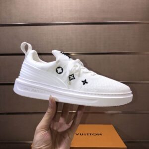 all-white Louis Vuitton Knit Sock Runner Trainer Sneakers, showing the knit texture, black Monogram symbols on the side and tongue, and the matching white rubber sole.