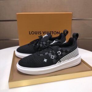 A pair of black Louis Vuitton Knitted Runner Trainer Sneakers with a subtle checked pattern, white Monogram symbols, a white rubber sole, and a white striped side panel.