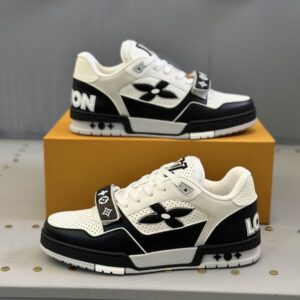 Black and White Louis Vuitton LV Trainer-style sneaker, low-top profile, premium leather, velcro strap detail, side logo branding, rubber outsole, high-contrast black and white colorway.