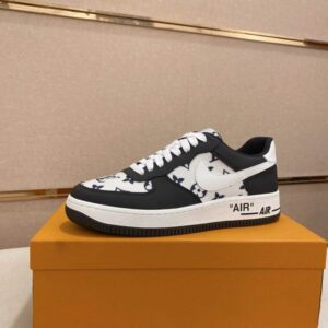 Black low-top Louis Vuitton inspired sneaker with white sole, gray heel tab, and colorful floral embroidery around the LV logo on the side.