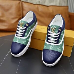 Louis Vuitton Monogram Low Top Sneaker in green and navy blue, featuring gradient Monogram canvas, navy leather toe, gold LV logo, and a white sole.