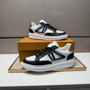 White, Black, and Tan Louis Vuitton Trainer-Archlight style sneaker, perforated leather, chunky white sole, black V-logo on side, tan heel accent.