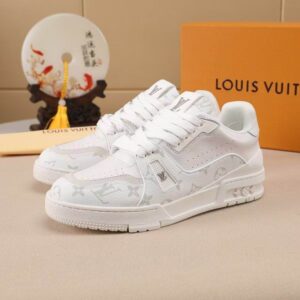 Louis Vuitton Trainer Sneaker in white leather with subtle Monogram embossing, shown in a low-top silhouette with white laces.