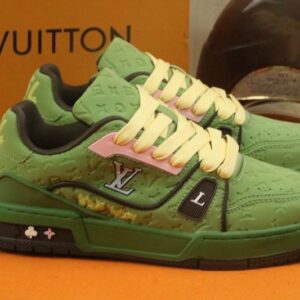 Close-up of the embossed monogram texture and LV logo on the Sage Green trainer.