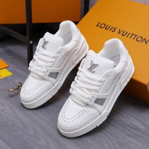 LV Trainer Style Sneaker All White front view with rivet detail on orange box.