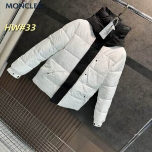 A white Moncler-inspired puffer jacket with a thick black vertical stripe down the center and a matching black hood.