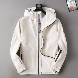 Black Moncler GORE-TEX technical hooded jacket styled on a mannequin over a white t-shirt, showing the vertical "#MONCLER" text on the placket.