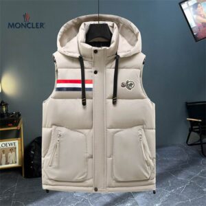 A beige hooded puffer vest with horizontal quilting, featuring a full snap-button front, two zippered pockets, and a rectangular tri-color stripe patch on the left chest.