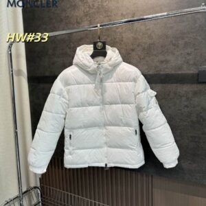 Front view of a white Moncler Maire puffer jacket hanging on a rack, featuring a glossy finish, detachable hood, and a signature logo on the sleeve pocket.