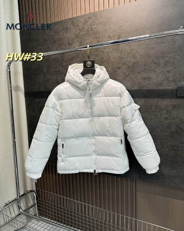 Front view of a white Moncler Maire puffer jacket hanging on a rack, featuring a glossy finish, detachable hood, and a signature logo on the sleeve pocket.