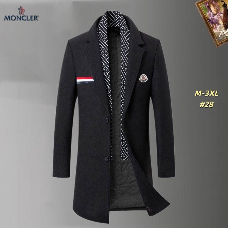 Men's light gray Moncler-style long wool-blend overcoat with tricolor stripe pocket trim, an embroidered logo patch, and a patterned scarf, displayed on a hanger.