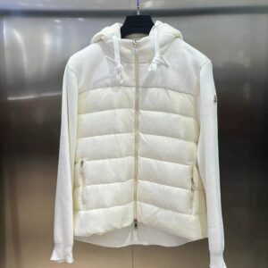 A white hooded hybrid jacket displayed on a hanger, featuring a horizontally quilted puffer panel on the front torso and white ribbed knit material on the sleeves and back. A small logo patch is visible on the left arm