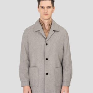 A midi-length, single-breasted charcoal wool coat featuring three front patch pockets, a turn-down collar, and buttoned cuffs in a structured, straight-cut silhouette.