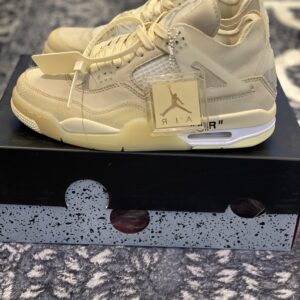 Full side profile of the Nike Air Force 1 Low White sneaker; highlights the all-white synthetic leather upper, the perforated toe box, the padded collar, and the thick white midsole.