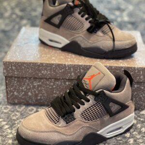 Side profile of Air Jordan 4 Retro Taupe Haze showing cracked texture and sail midsole.