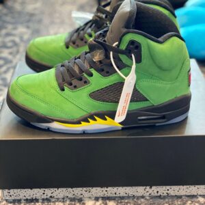 Profile view of the Jordan 5 SE Oregon Apple Green sneaker highlighting the green nubuck and black midsole.