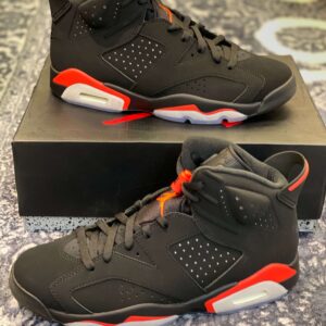 Side profile of the Air Jordan 6 Infrared showing the black suede, red midsole accents, and perforated panels.