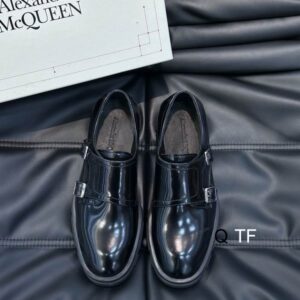 Alexander McQueen Black Leather Buckle Loafers with silver-toned side buckle and geometric sole.